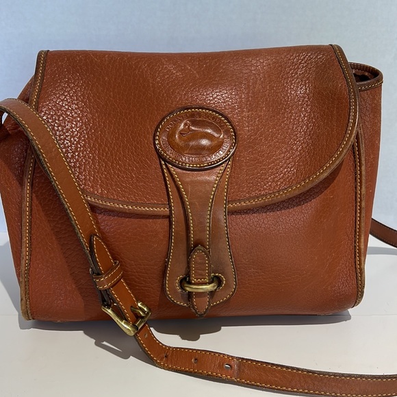 Dooney & Bourke Handbags - ❄️  VINTAGE Dooney & Bourke Essex All Weather Leather Saddle Shoulder Bag - Rare